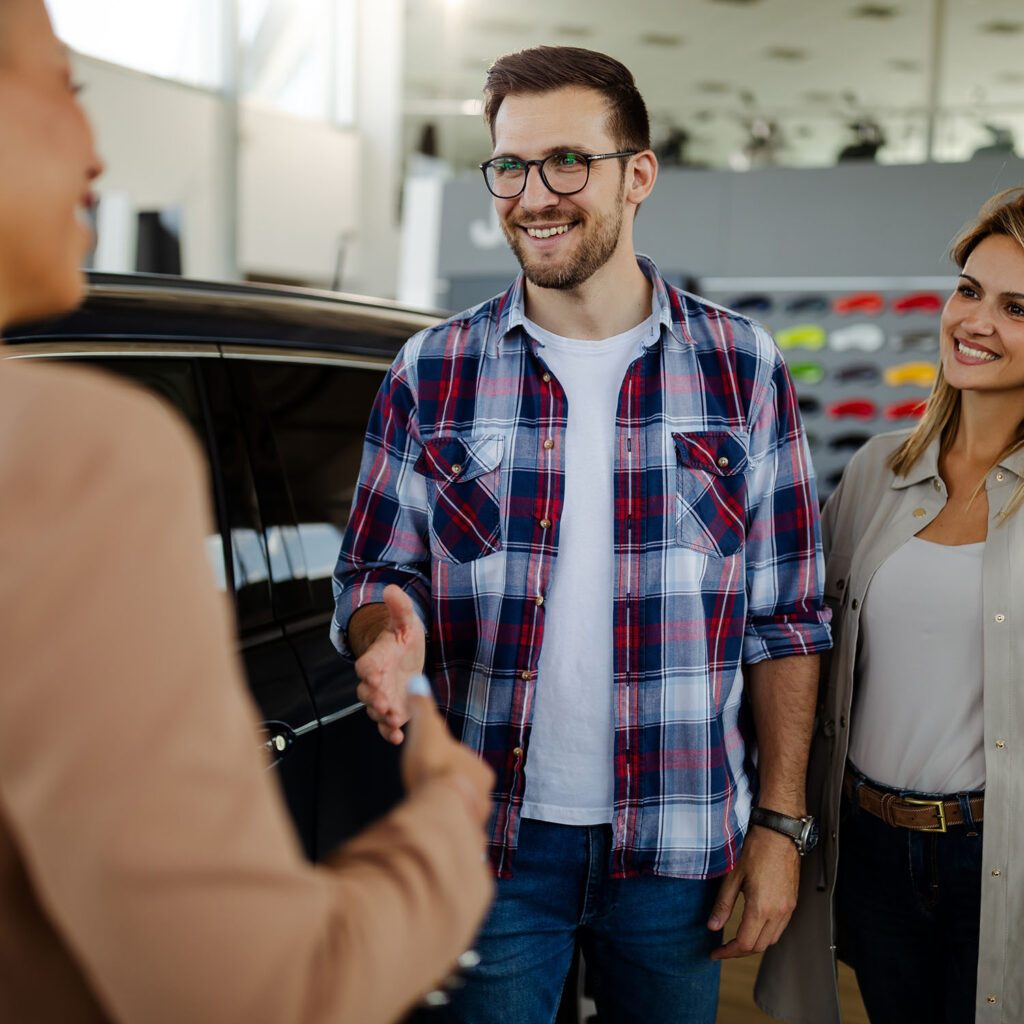 Handsome Man Shaking Hands With Beautiful Saleswom Eptyva9.jpg